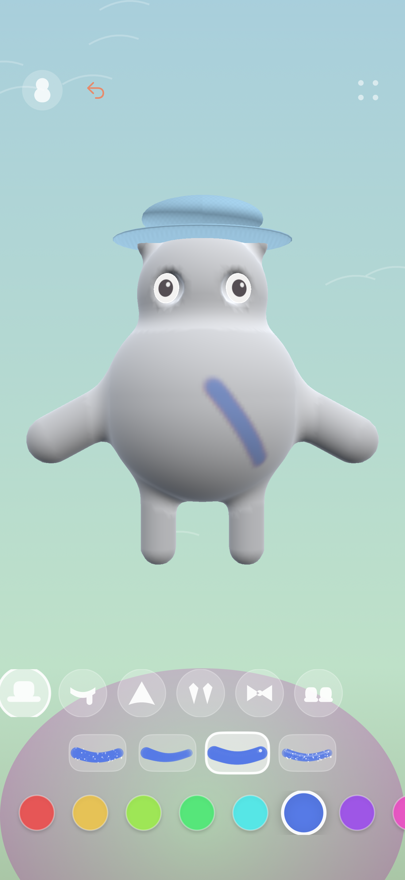Bisque on iPhone: a ceramic creature with a blue hat and a blue brushstroke, above the painting tools and colour palette.